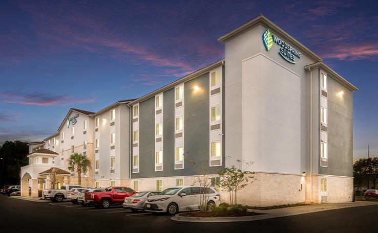 Extended Stay Hotel In Jacksonville FL WoodSpring Suites   WOODSPRING SUITES JACKSONVILLES EXTENDED STAY HOTEL EXTERIOR DUSK 1 738X456~800 