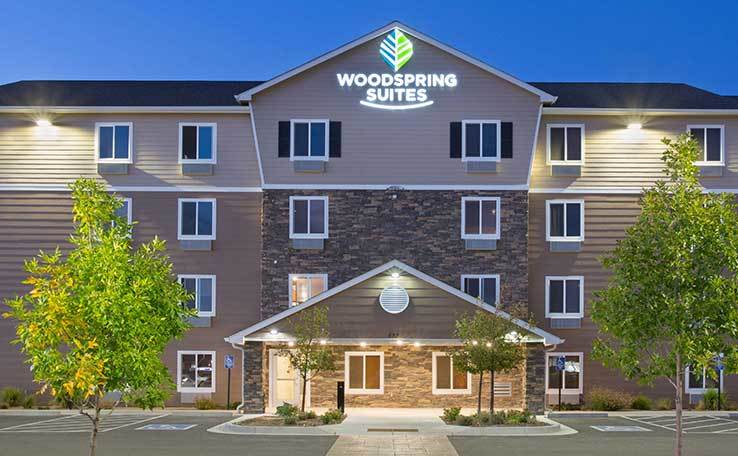 Extended Stay Hotel In Grand Junction CO WoodSpring Suites Grand   WoodSpring Suites Grand Junction Extended Stay Hotel Dusk 1 Exterior 738x456~800 