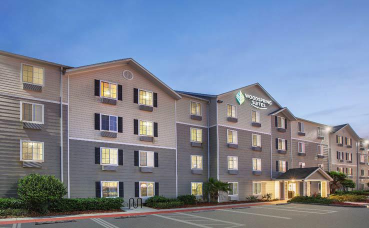 Extended Stay Hotel In Jacksonville FL WoodSpring Suites   WOODSPRING SUITES JACKSONVILLESE EXTENDED STAY HOTEL EXTERIOR DUSK 2 738x456~800 