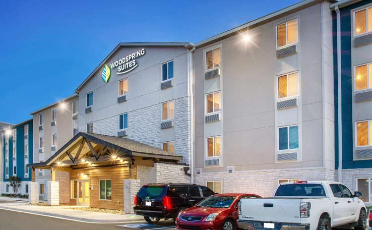 WOODSPRING SUITES CHARLOTTENORTHLAKE EXTENDED STAY HOTEL EXTERIOR DUSK 3 738x456~800